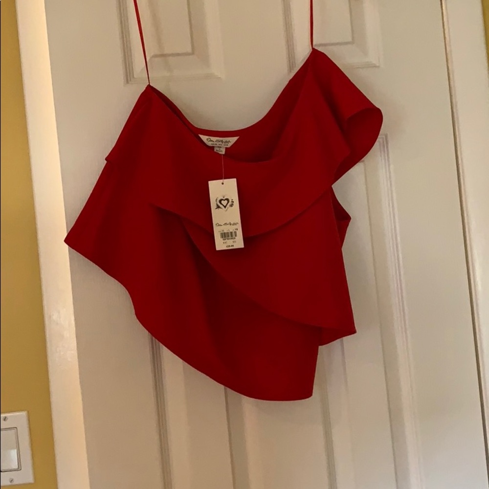 Red one shoulder blouse.